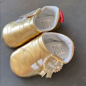 # 1 Baby gold new 18-24 mo. New shoes!